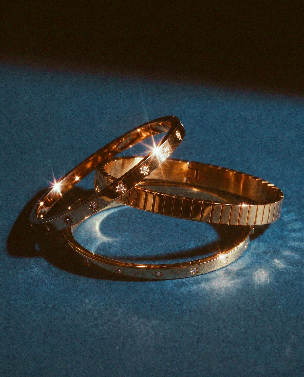 Gold celestial and ice cube bangles catching the light